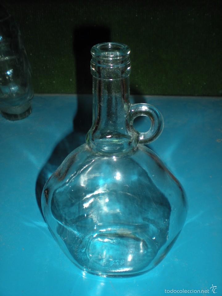 Vintage: Botella de vidrio de forma peculiar 8x14x22cm
