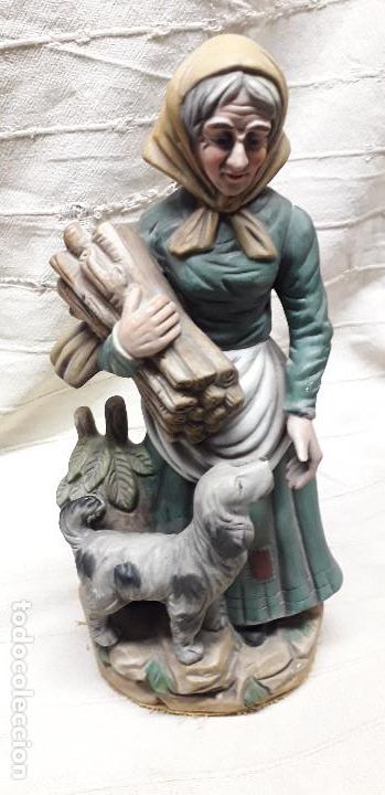 Vintage: Figura de porcelana mujer con le&ntilde;a y perro