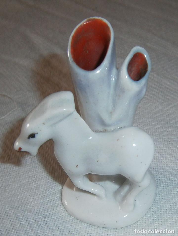 Vintage: palillero de porcelana con un animal