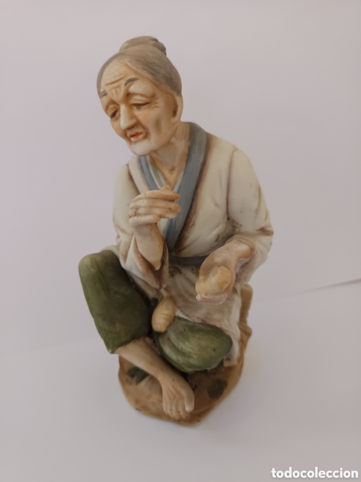 Vintage: Figura anciana biscuit elaborando pan