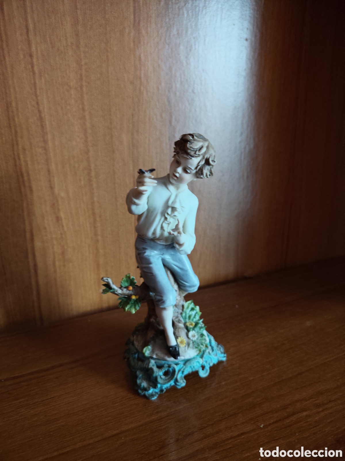 Vintage: Figura vintage ni&ntilde;o con mariposas