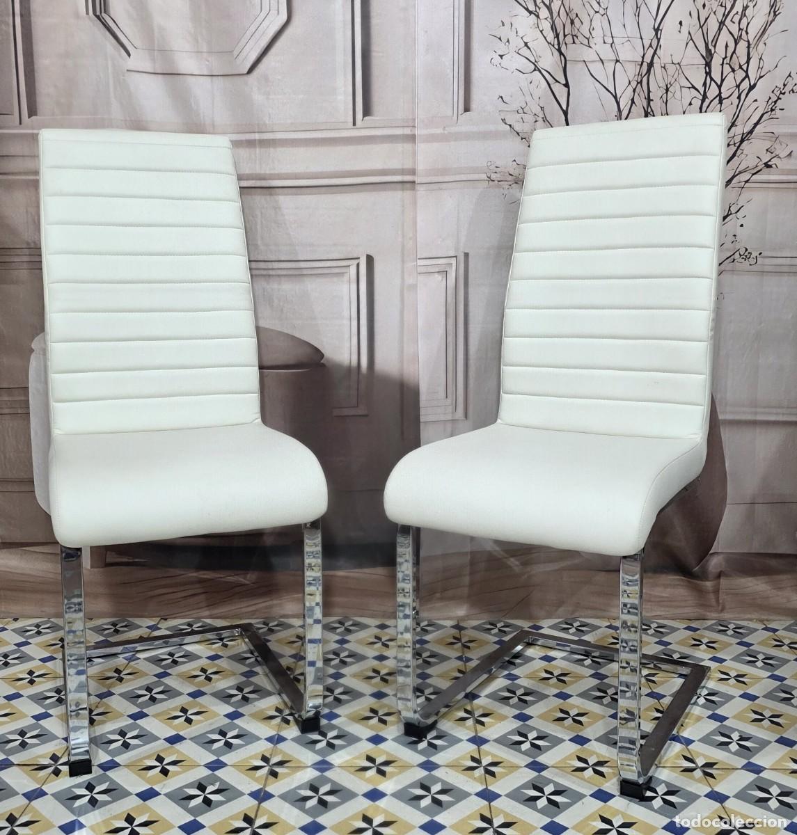 Vintage: Pareja de sillas dise&ntilde;o moderno en piel y acero cromado, disponibles 12 und.