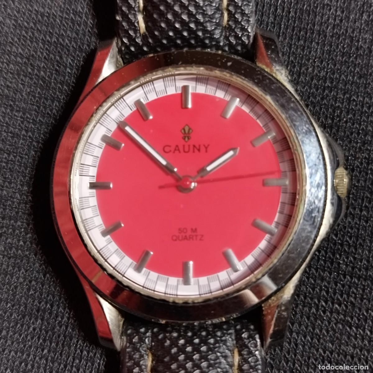 Vintage: RELOJ PULSERA CAUNY - ESFERA DE COLOR ROJO - QUARTZ 50M -