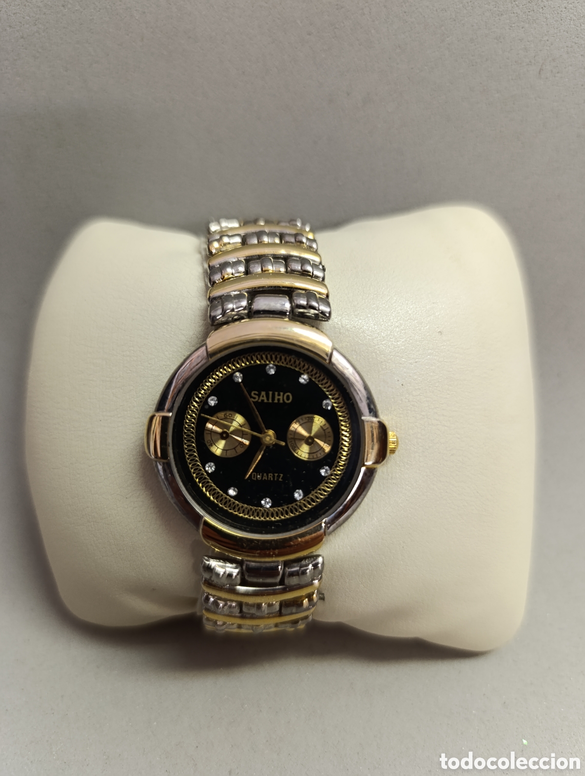 Vintage: RELOJ DE PULSERA SAIHO. QUARTZ. CAJA DORADA Y PLATEADO. METAL.