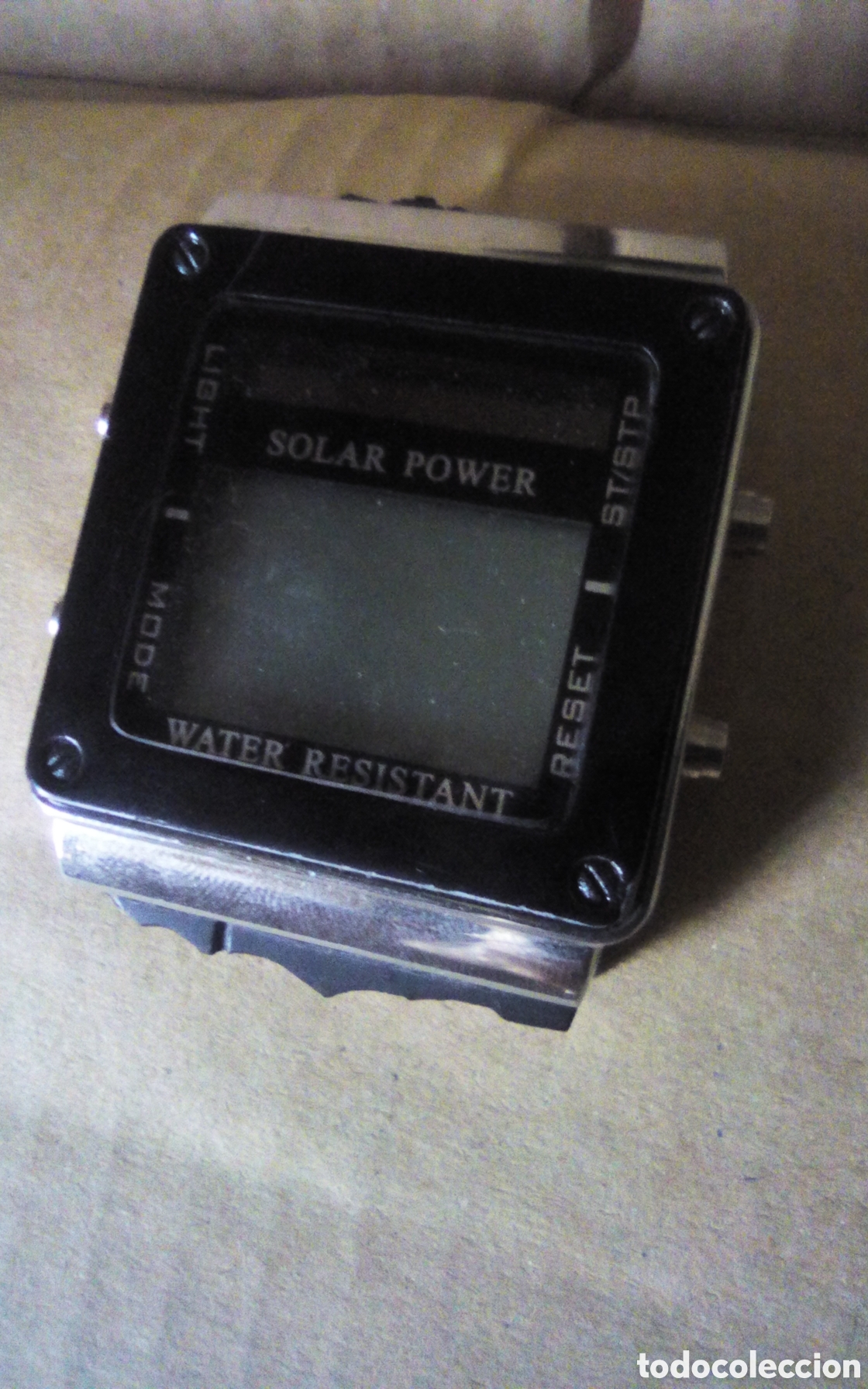 Vintage: Reloj Solar Power. Water resistant. Stainless Steel Back. W840. Mide 5 x 4 cm. Correa rota a reparar