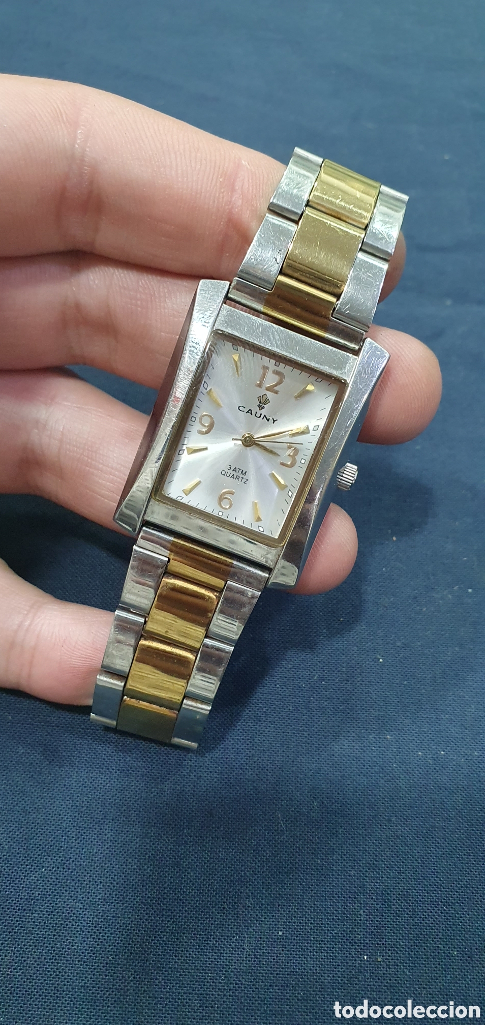 Vintage: Reloj Cauny acero y dorado. (L134)