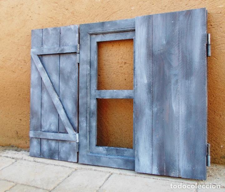 ventana de madera con postigos o contraventanas,azul decapada, vintage