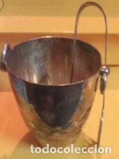 Cubitera con pinzas. Ba&ntilde;ada en plata.