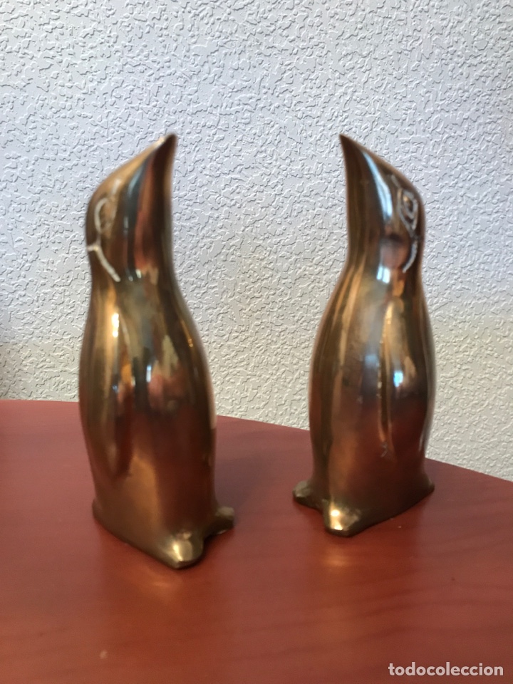 Vintage: Lote 2 ping&uuml;inos de bronce. Alto 13 cm