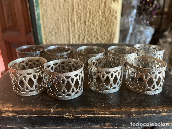Vintage: Juego de nueve servilleteros en metal muy bonitos.
