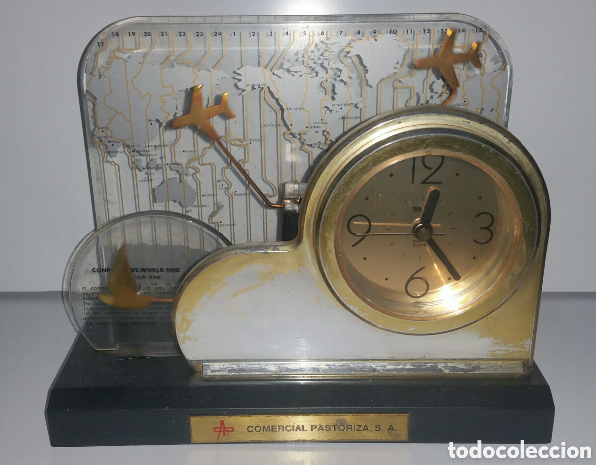 Vintage: Reloj con balanc&iacute;n de figuritas met&aacute;licas, publicidad comercial de los a&ntilde;os 70. ( funcionando )
