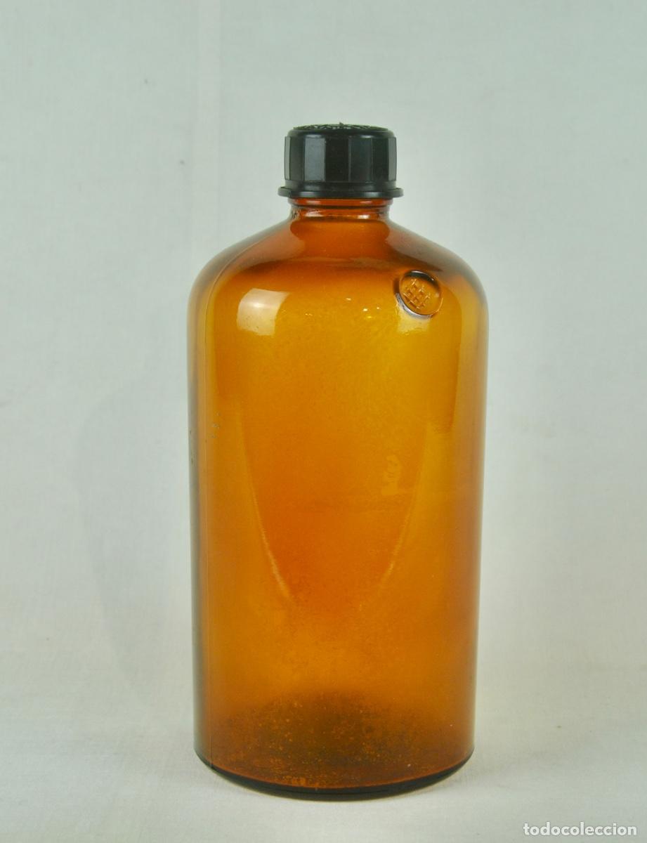 Vintage: Botella de farmacia ambar con tapon negro