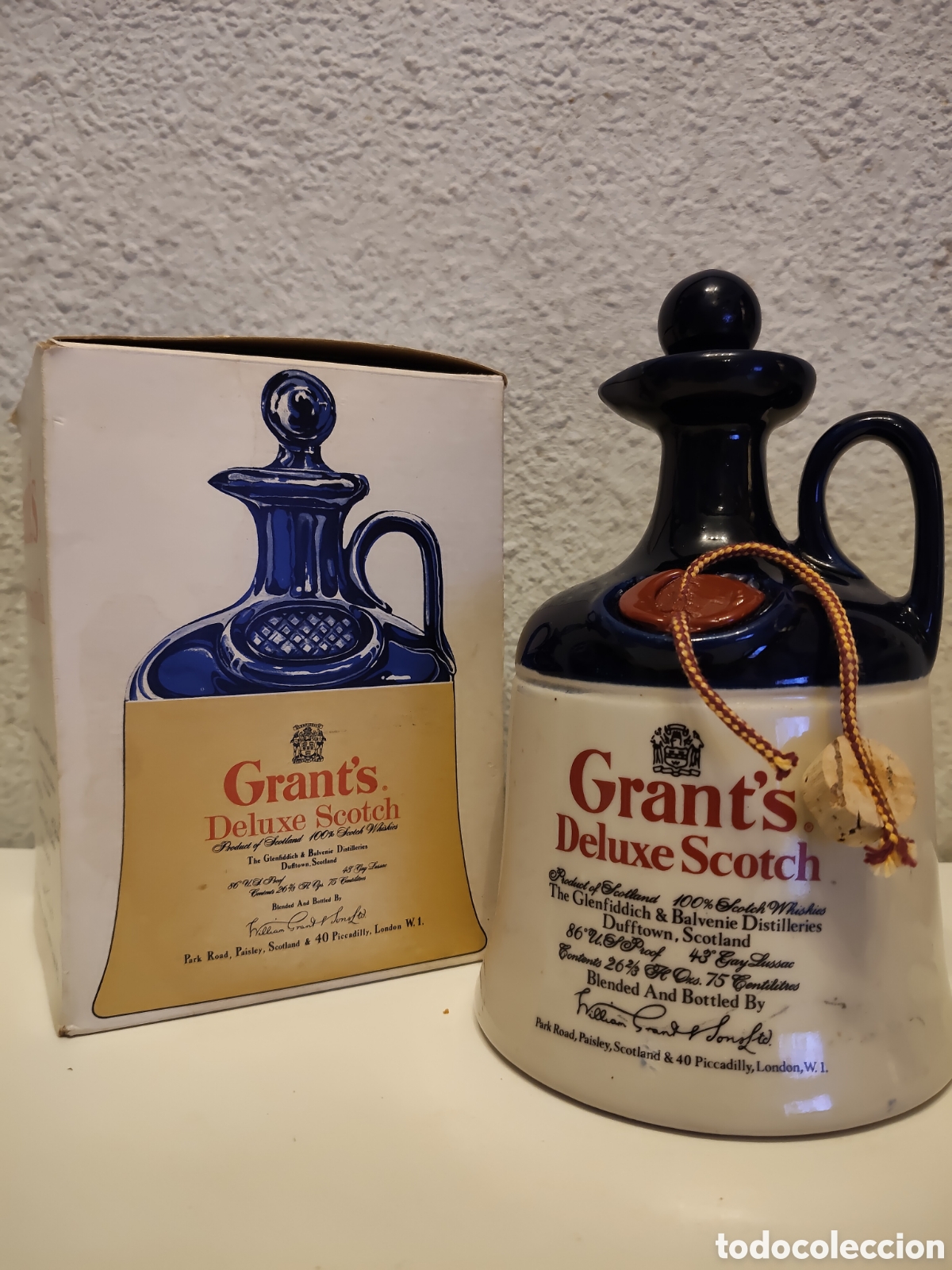 Vintage: BOTELLA VAC&Iacute;A DE WHISKY GRANT'S DELUXE SCOTCH