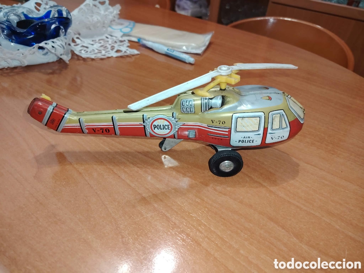 Vintage: Elicoptero police , de paya , funciona , es de hojalata, vintage